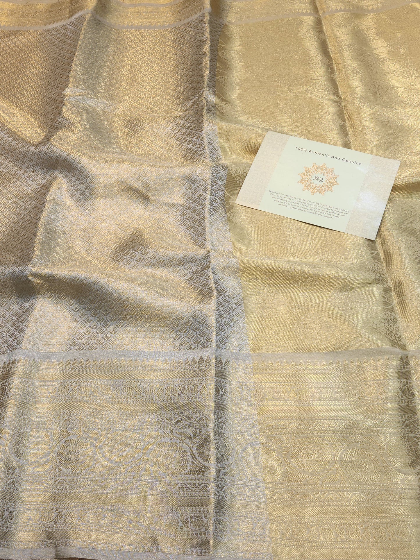 Celebrity Inspired tissue light golden embossed tissue silk Saree
