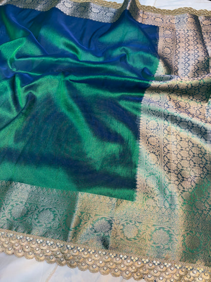 Metallic Peacock tissue silk saree with intricate lace work