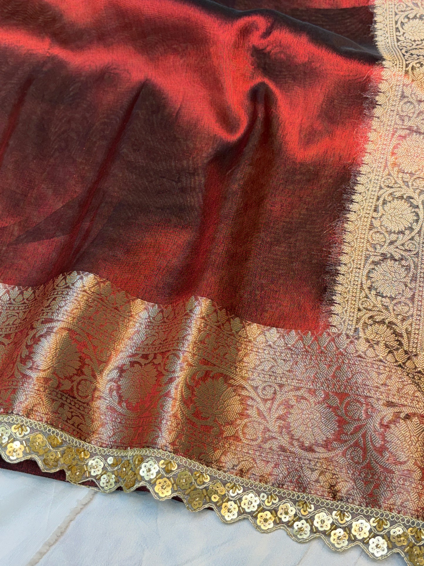 Metallic Red tissue silk saree with intricate lace work