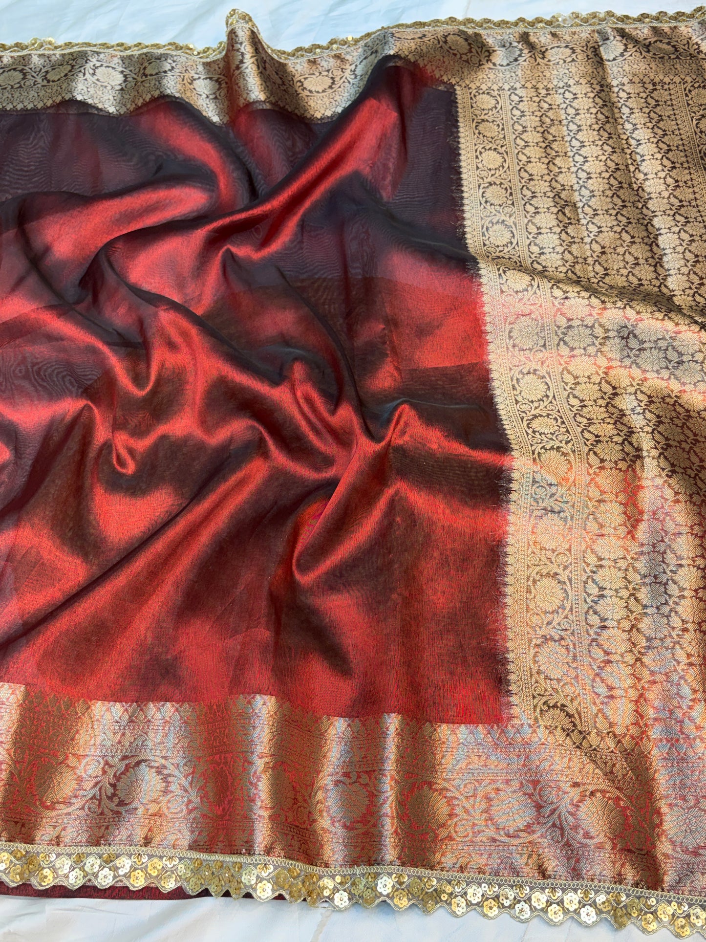 Metallic Red tissue silk saree with intricate lace work