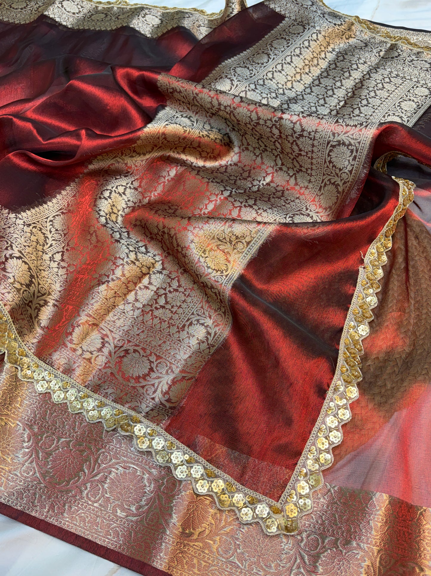 Metallic Red tissue silk saree with intricate lace work