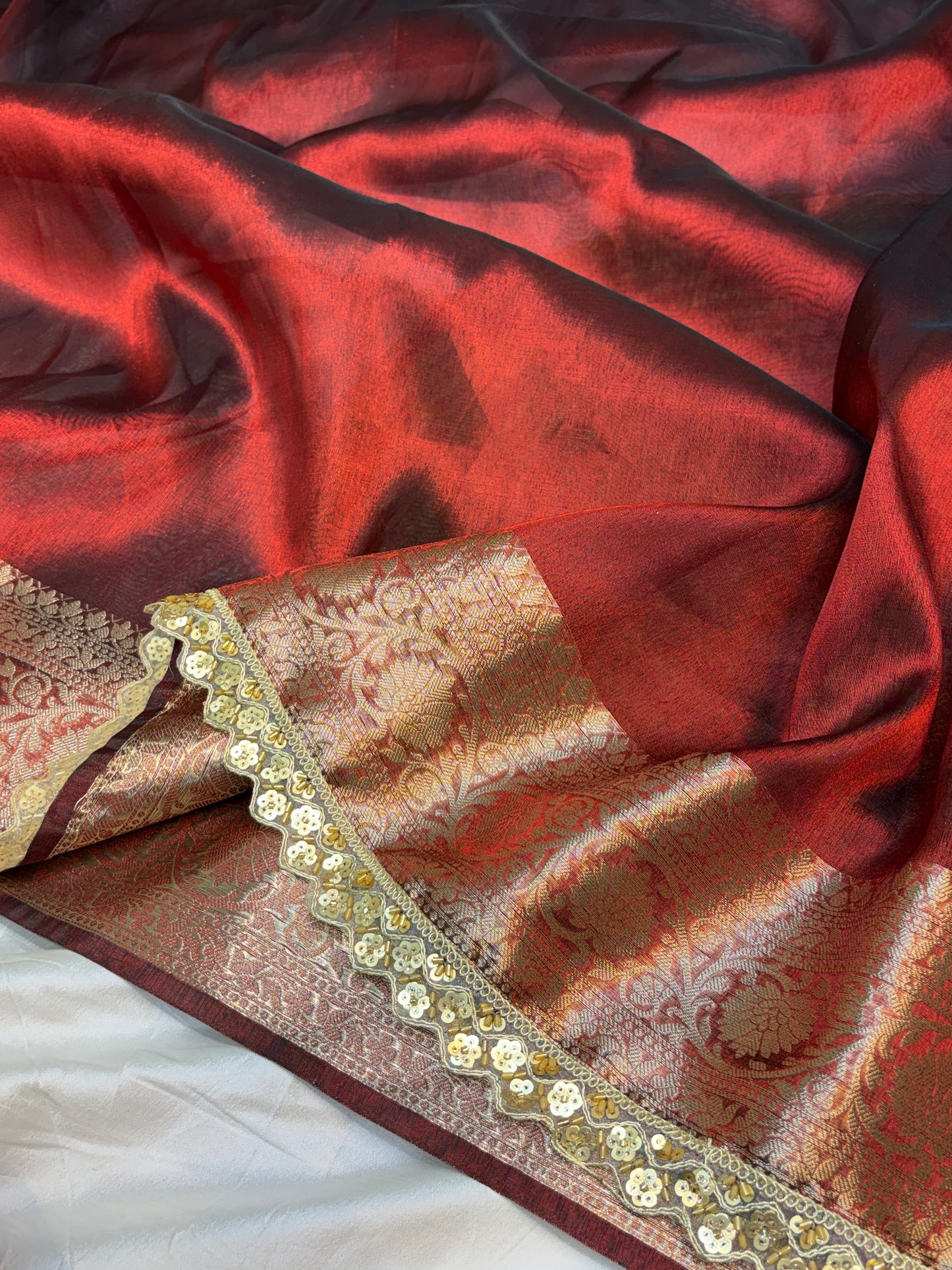 Metallic Red tissue silk saree with intricate lace work