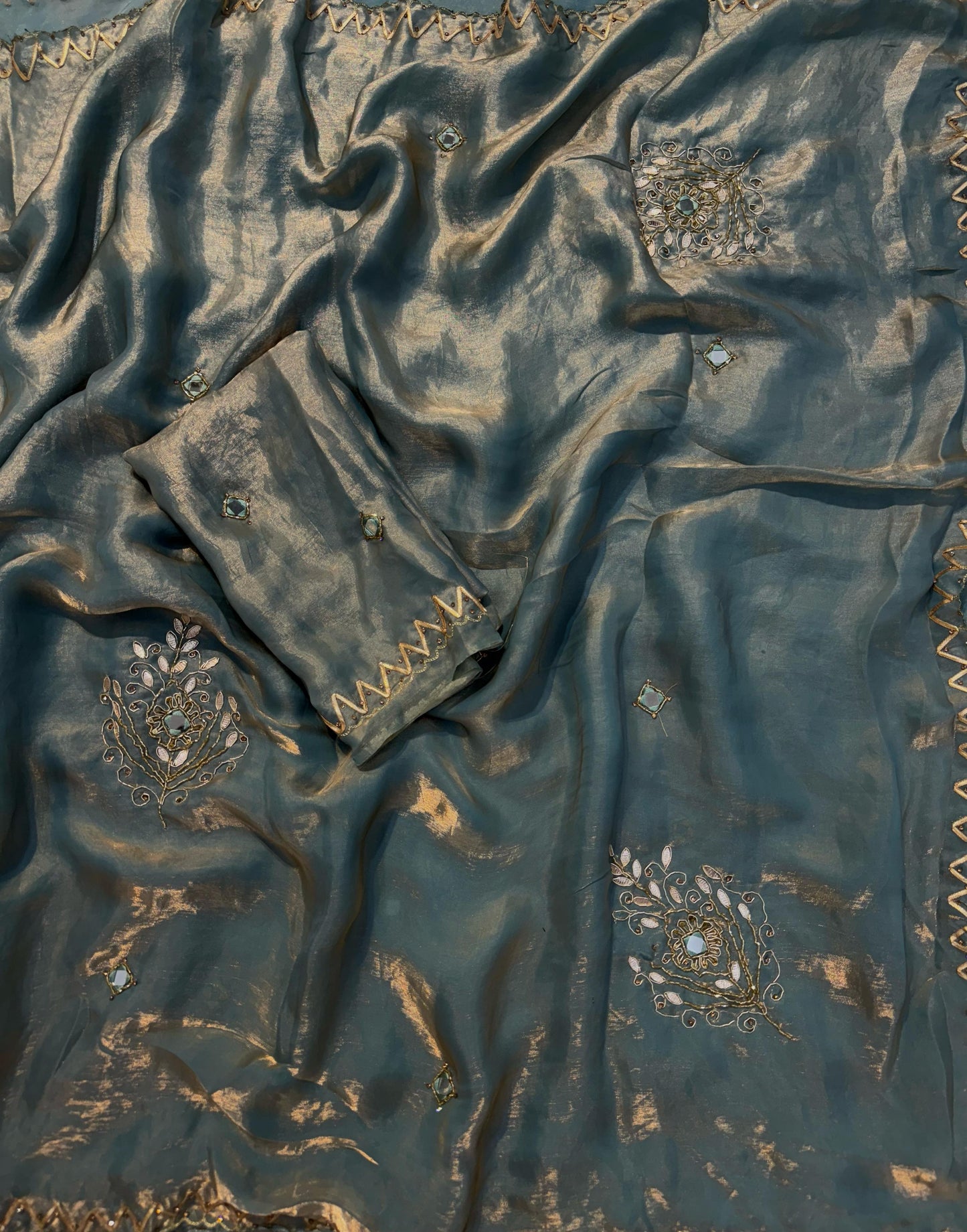 Shimmery tissue silk saree with handwork and designer blouse