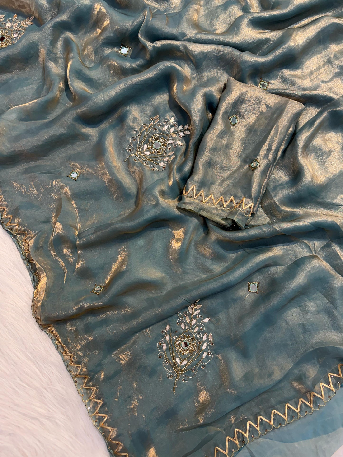 Shimmery tissue silk saree with handwork and designer blouse