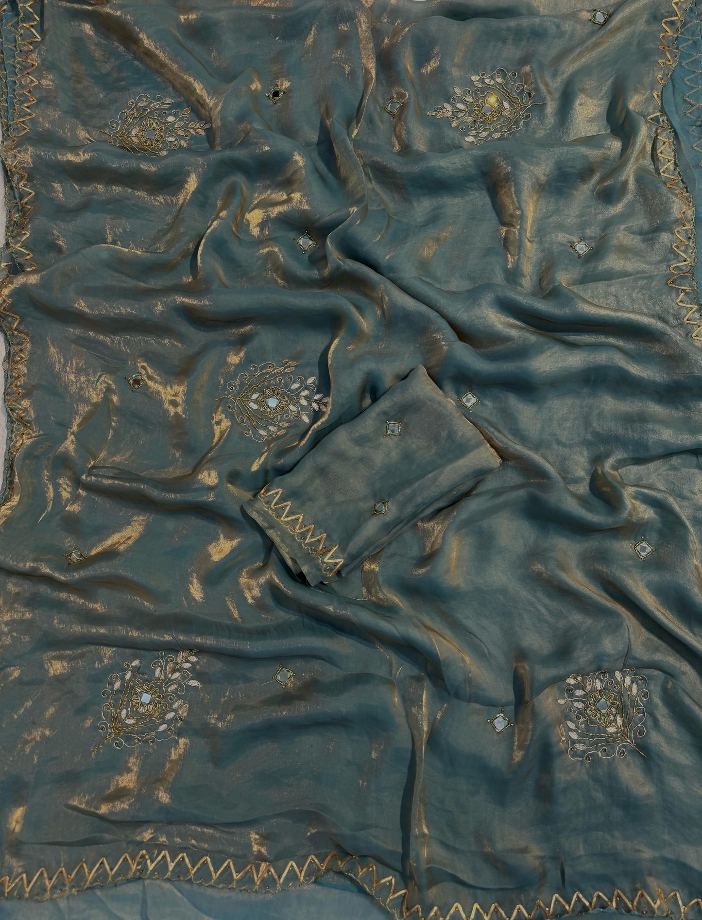 Shimmery tissue silk saree with handwork and designer blouse