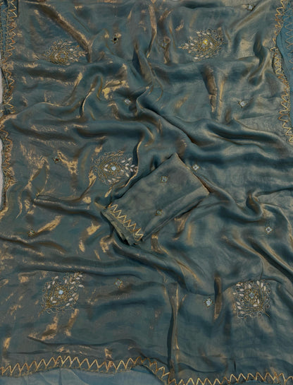 Shimmery tissue silk saree with handwork and designer blouse