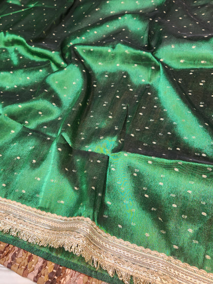Deep green tissue silk saree