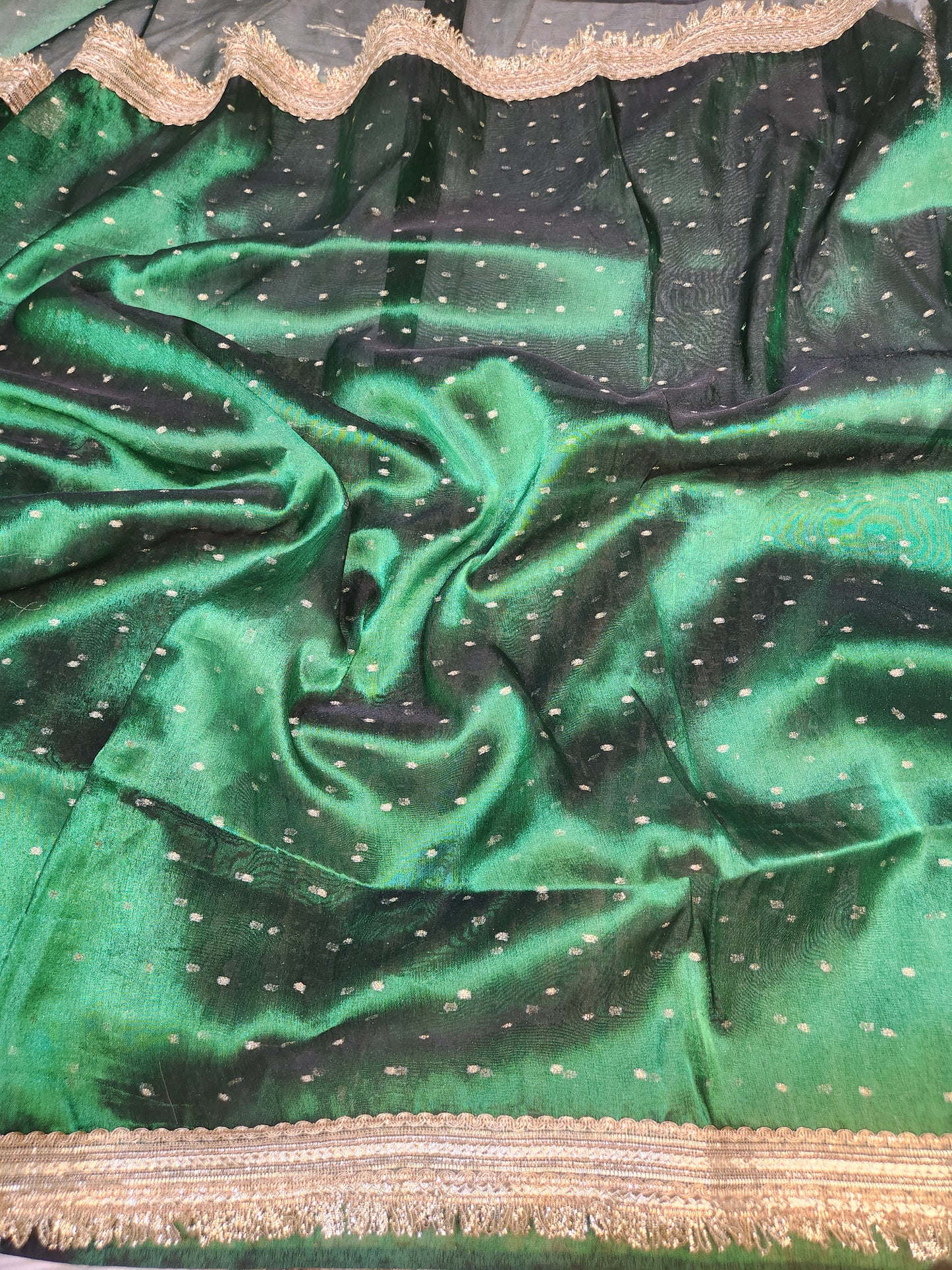Deep green tissue silk saree